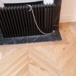 photographie-apres-travaux-du-parquet-en-bois-massif-et-de-l-entourage-de-la-cheminee-de-la-rue-jean-jaures